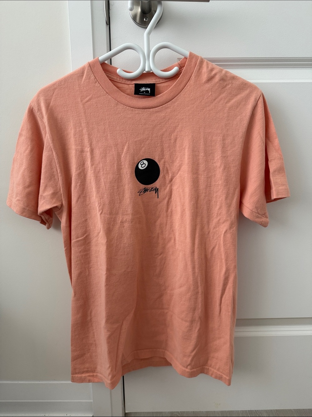 Stussy Peach Stock Tee with Black 8-Ball Graphic